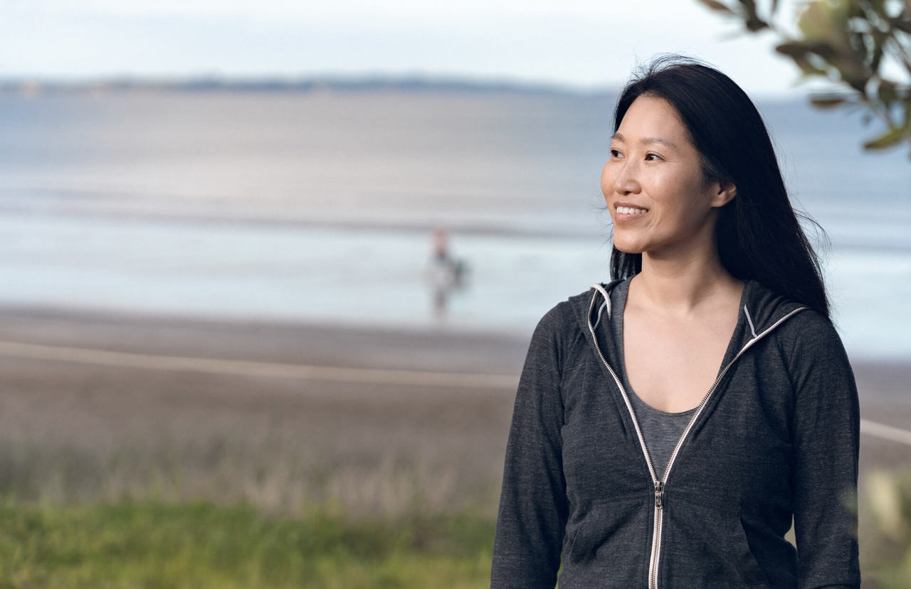 smiling asian girl in the park