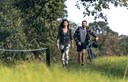 young couple with bike in the park