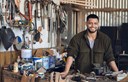 smiling young man at the workshop