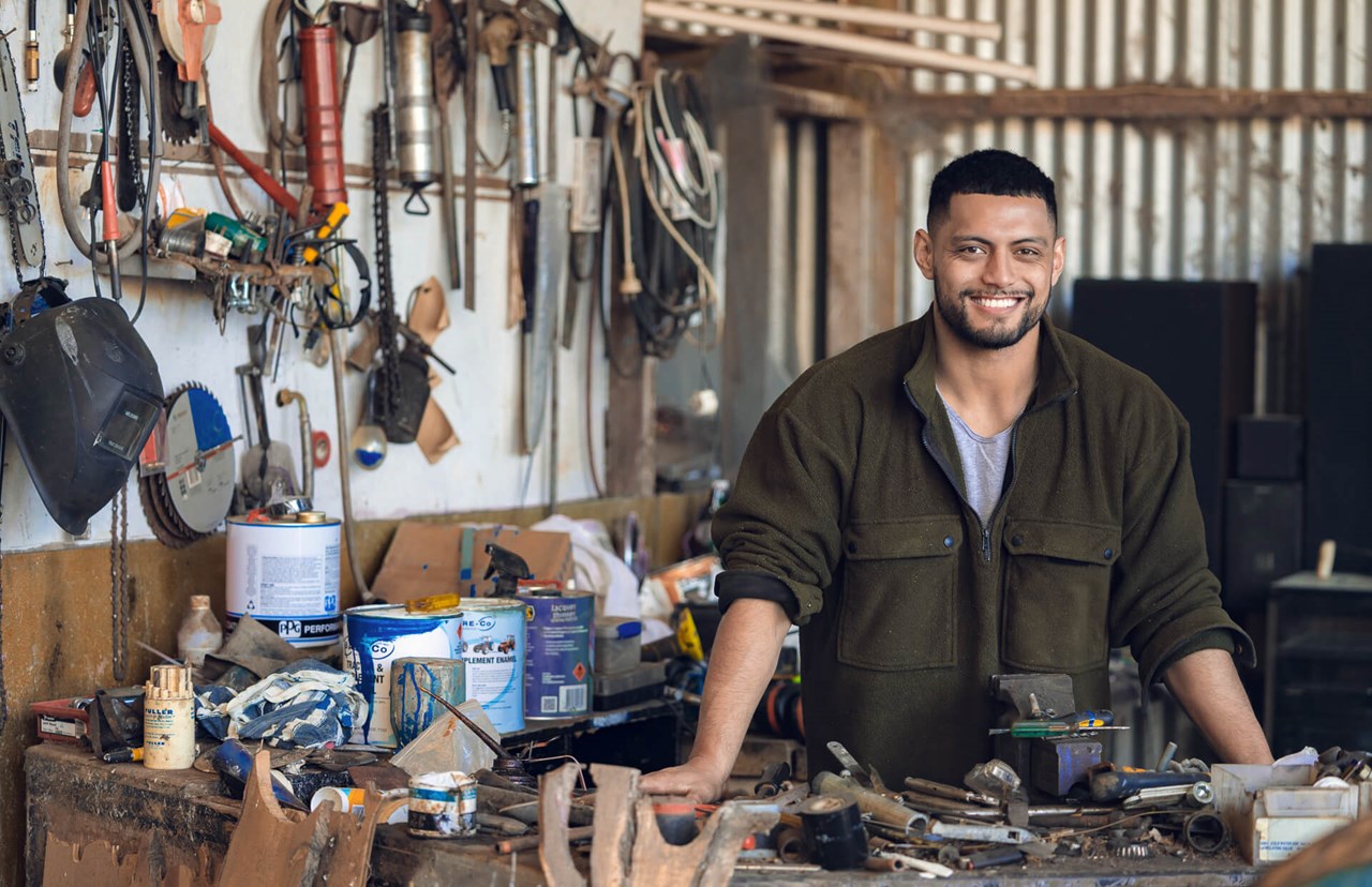 smiling young man at the workshop smiling young man at the workshop