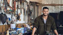 smiling young man at the workshop