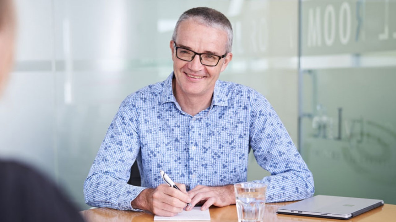 Adviser smiling at customer Adviser smiling at customer
