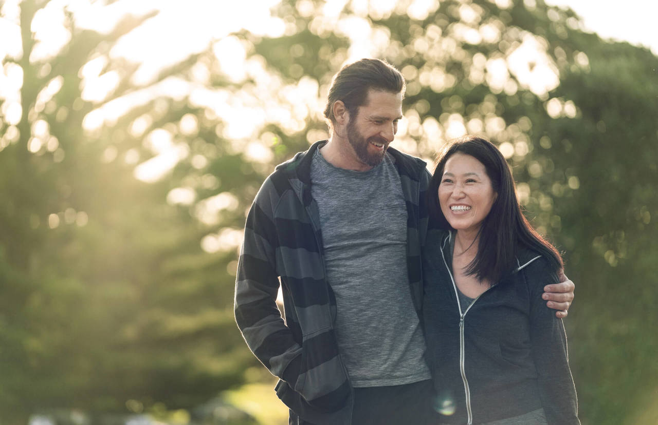 laughing couple in the park laughing couple in the park