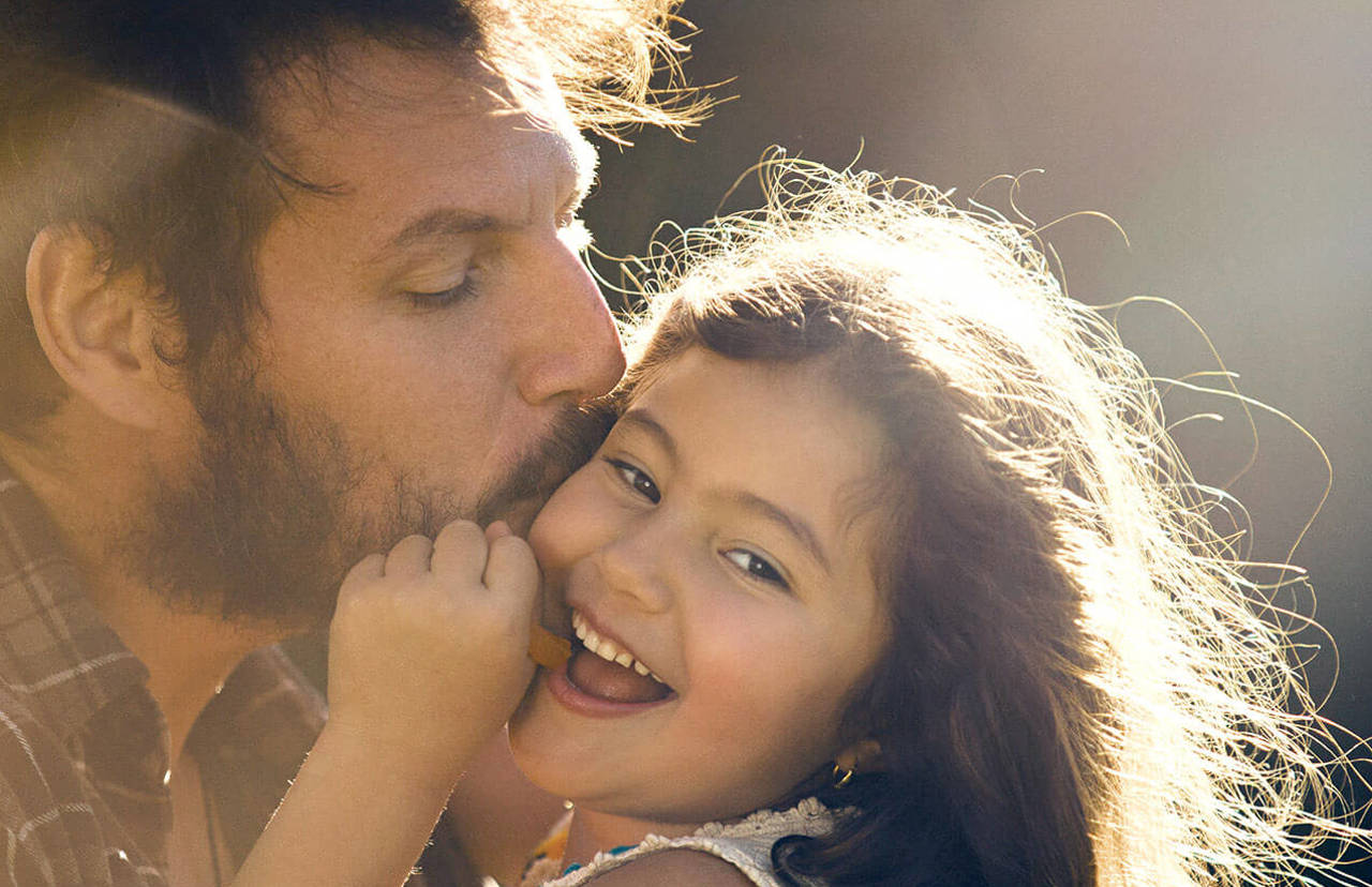 father holding daughter