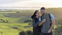 young couple smiling in the park