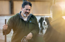 farmer with daughter and farm dog