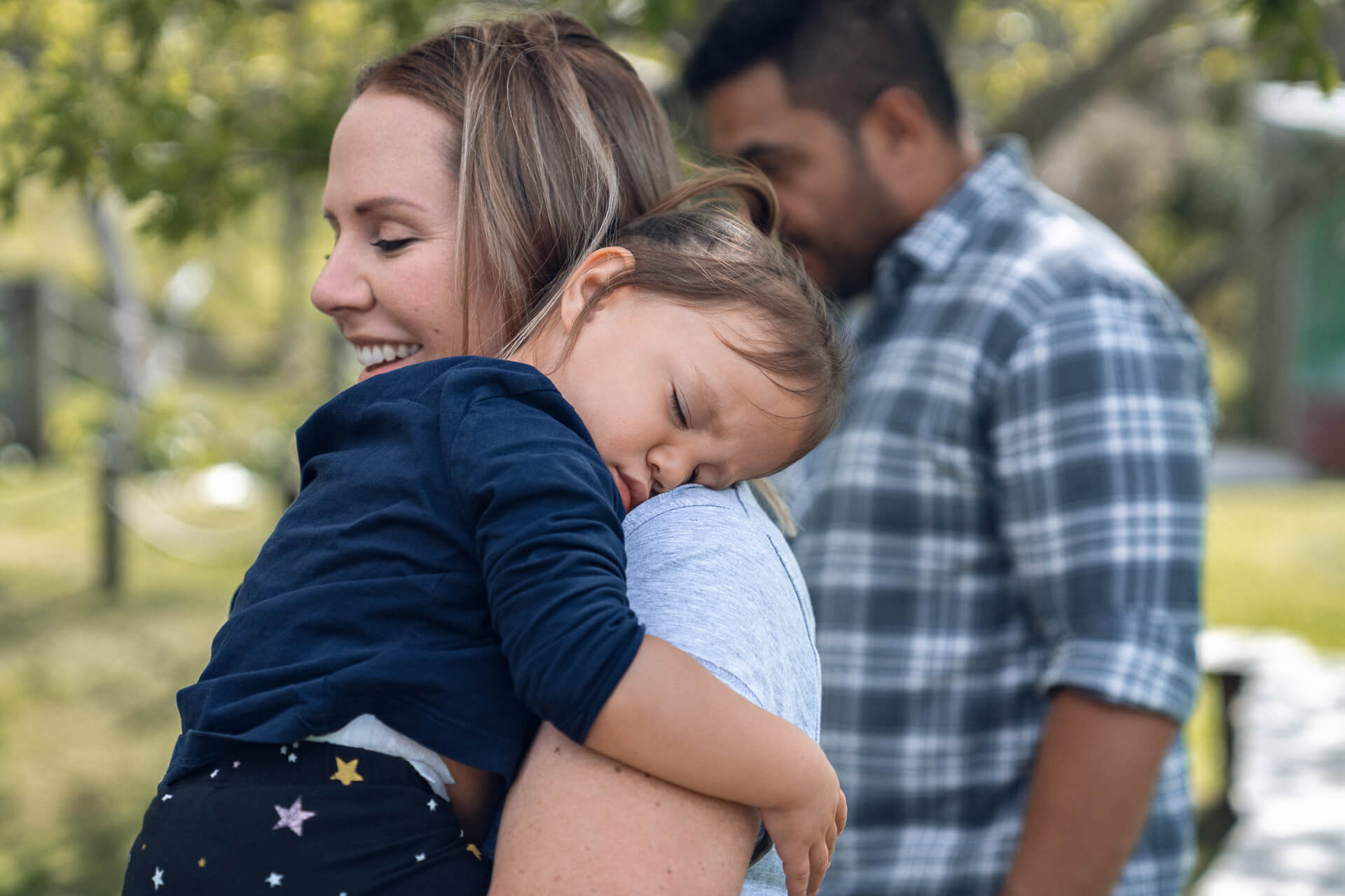 Mother & Father Holding a Child