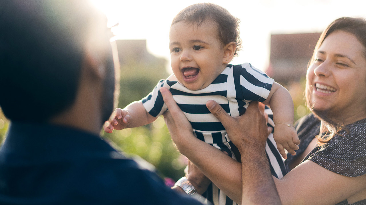 parents with happy baby